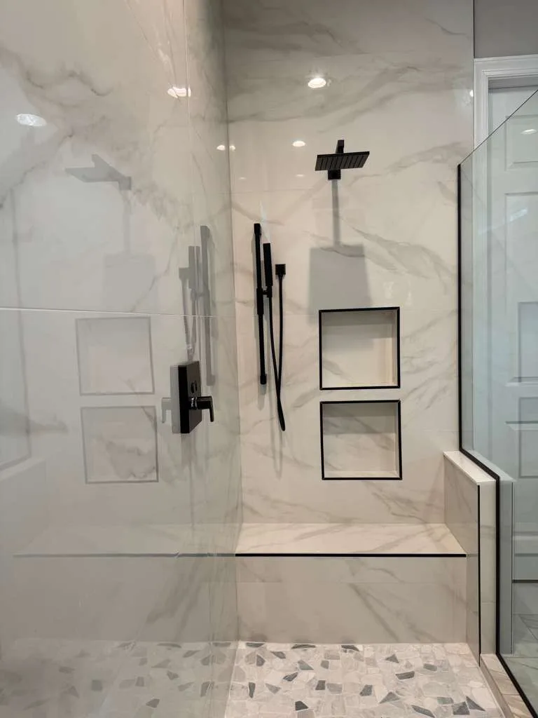 Calacatta walk-in shower with matte black fixtures